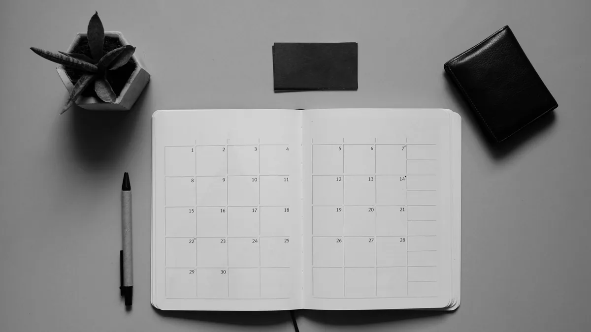 An open monthly planner on a desk